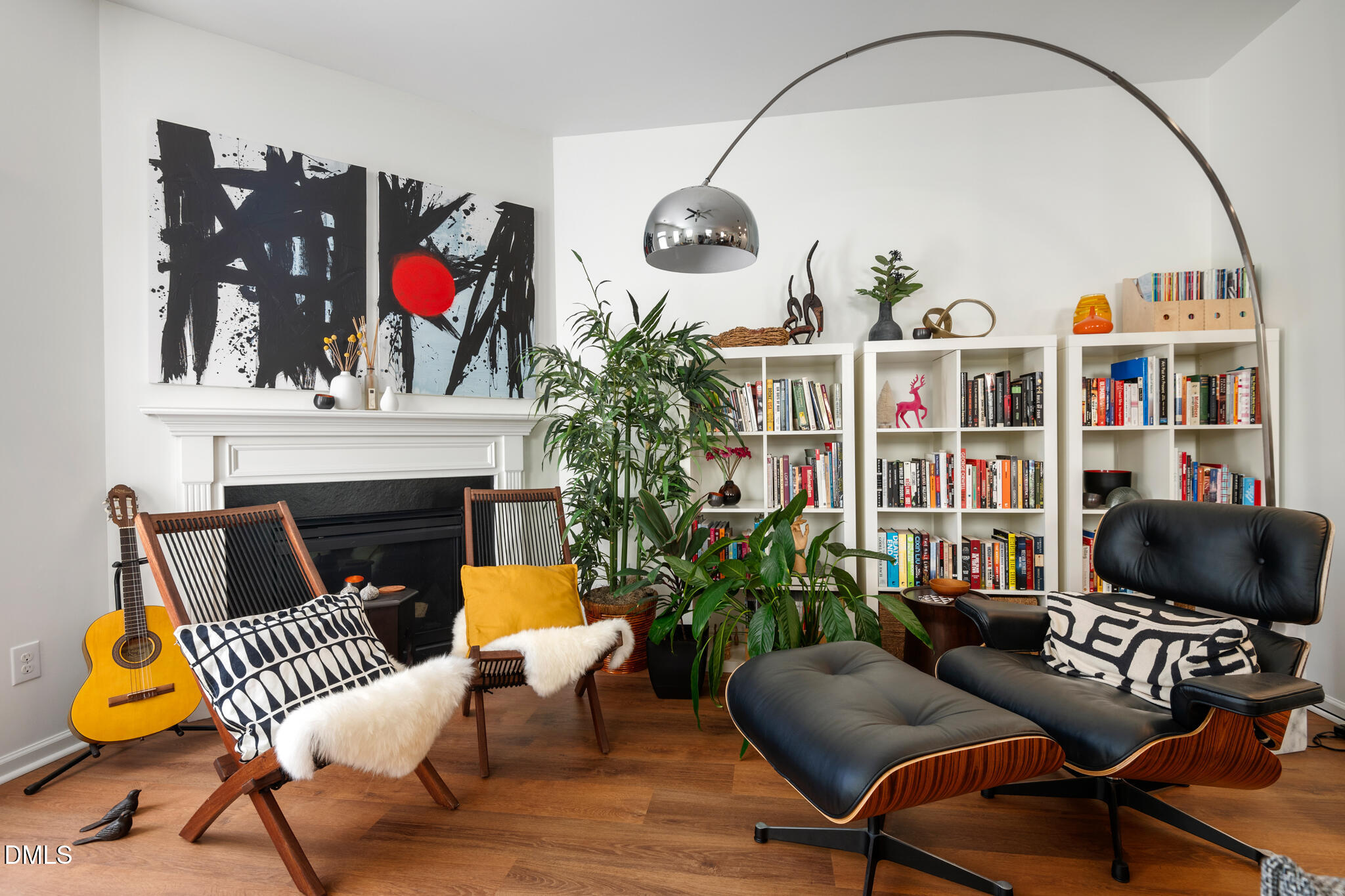 a living room with furniture fireplace and rug