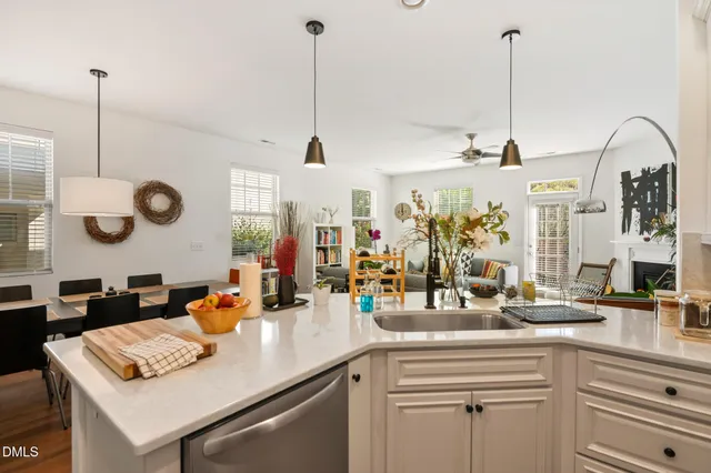 a kitchen with stainless steel appliances granite countertop a refrigerator sink and stove