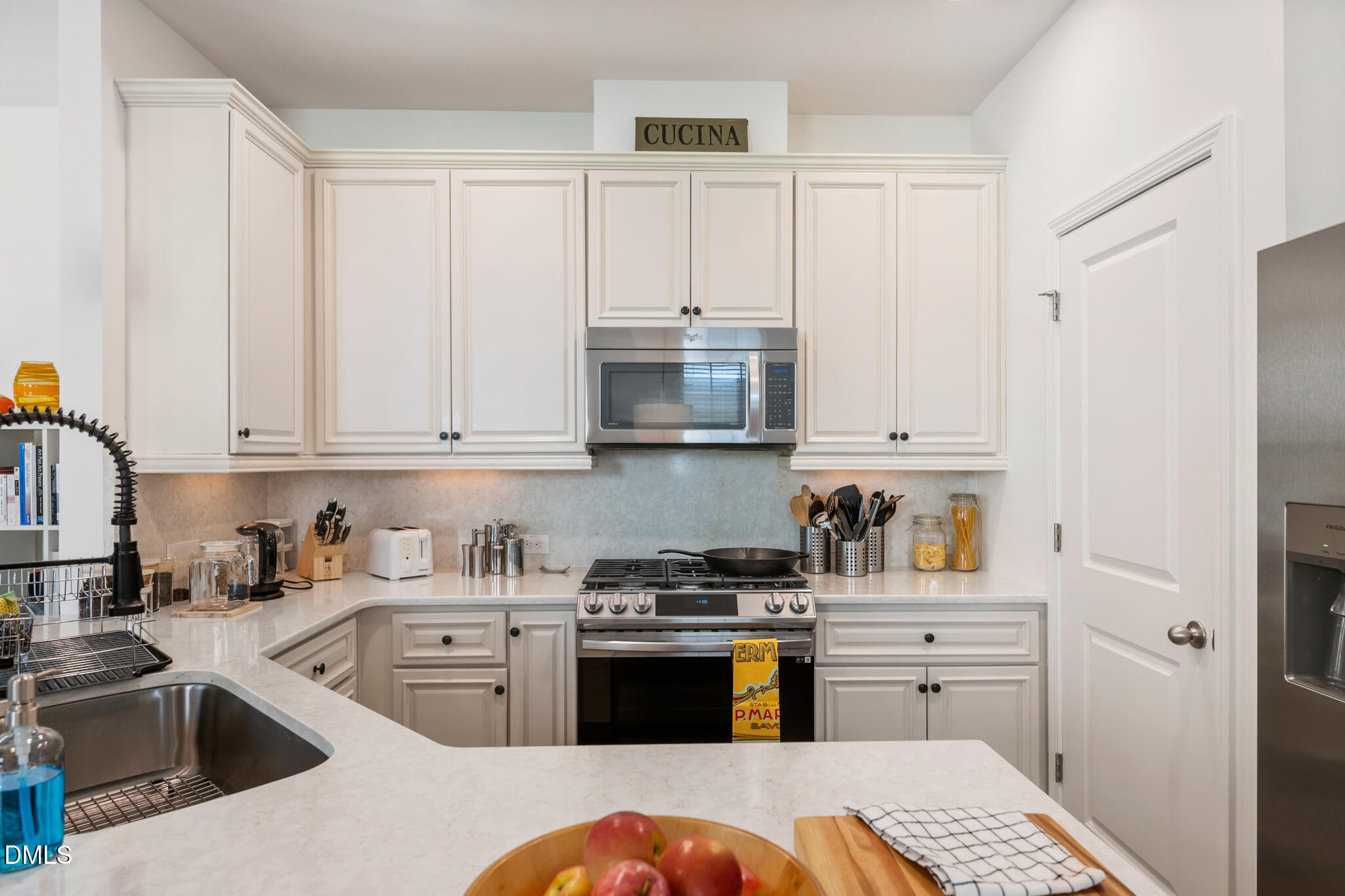 545 Libson Street Durham, NC 27703 - Photo 12 of 53 a kitchen with stainless steel appliances granite countertop a refrigerator sink and stove