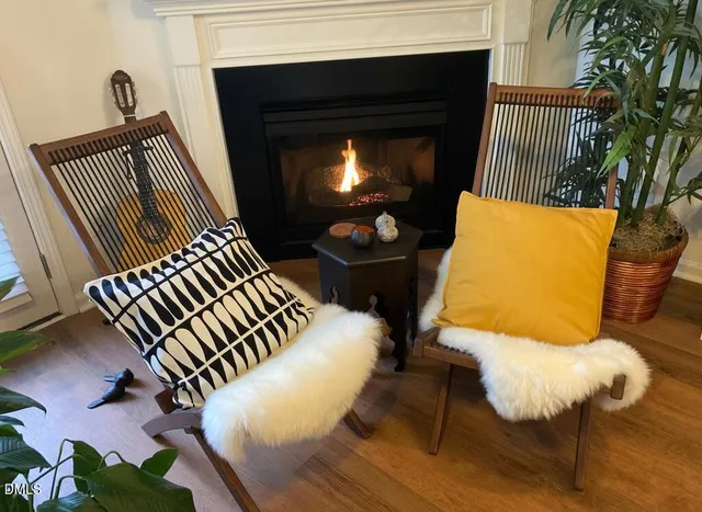 a living room with furniture ceiling fan and a rug