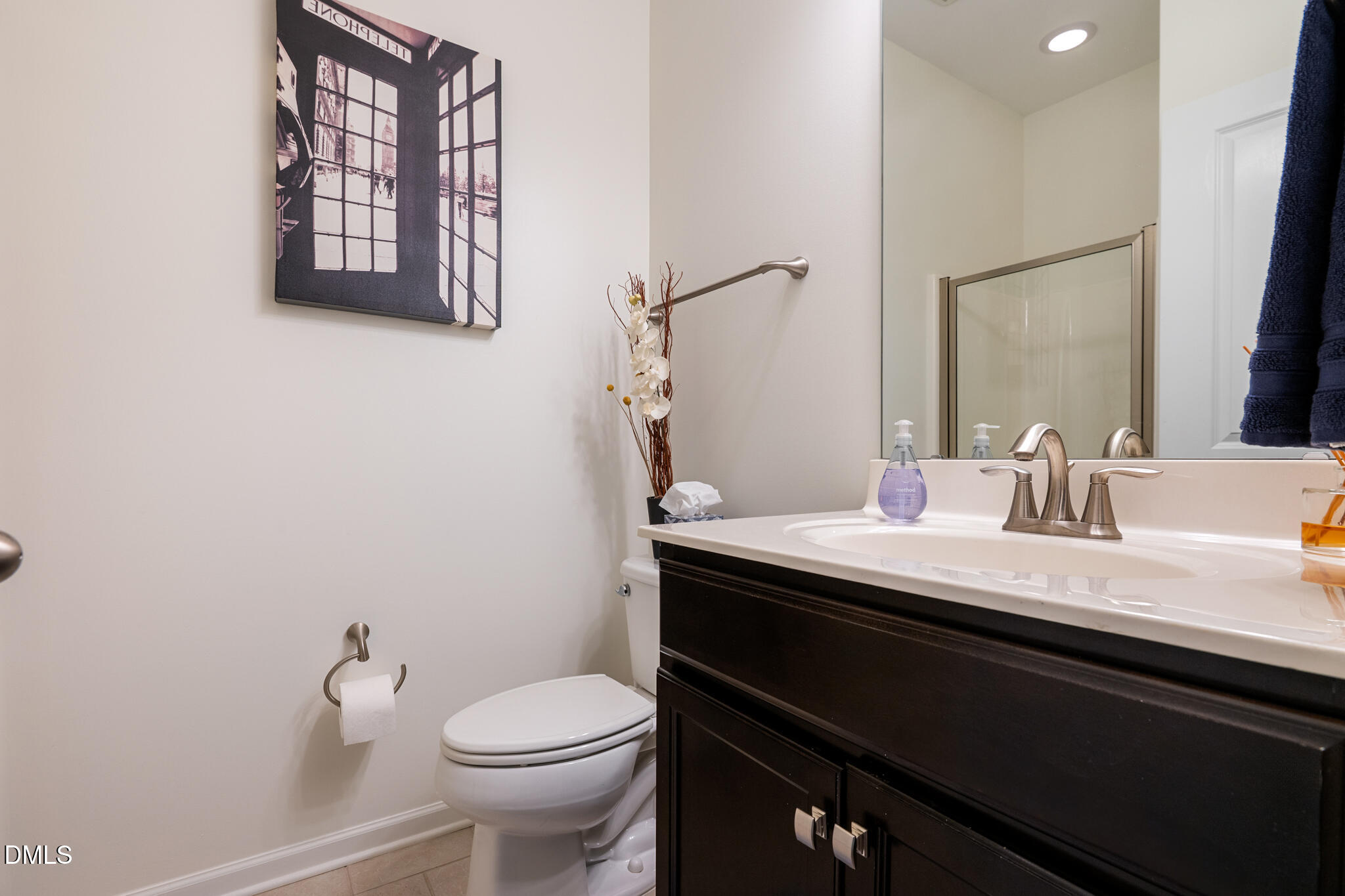 545 Libson Street Durham, NC 27703 - Photo 21 of 53 a bathroom with a granite countertop sink a mirror and a toilet