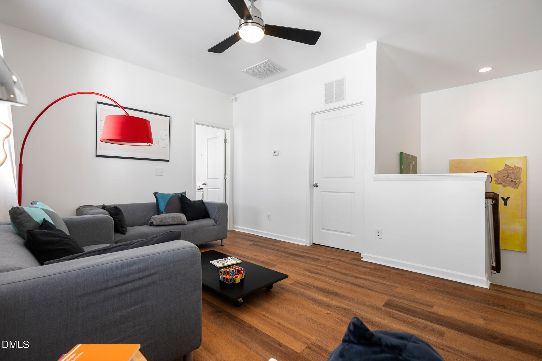 545 Libson Street Durham, NC 27703 - Photo 25 of 53 a living room with furniture and wooden floor