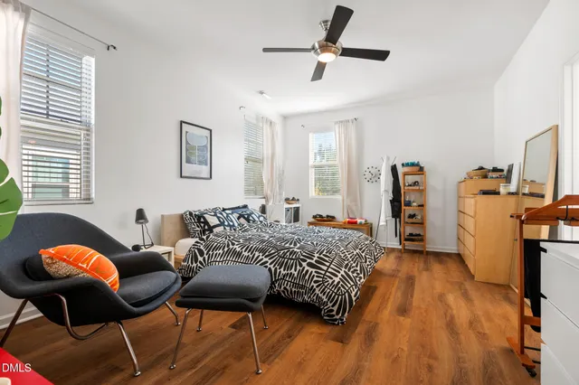 a bedroom with a bed and dresser