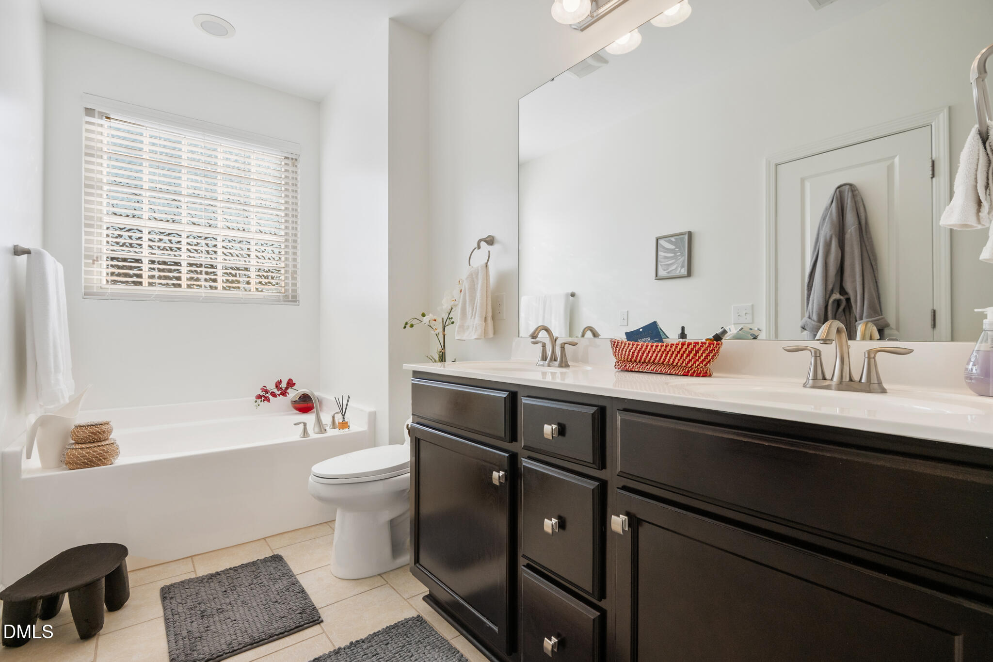 545 Libson Street Durham, NC 27703 - Photo 29 of 53 a bathroom with a sink double vanity and a toilet