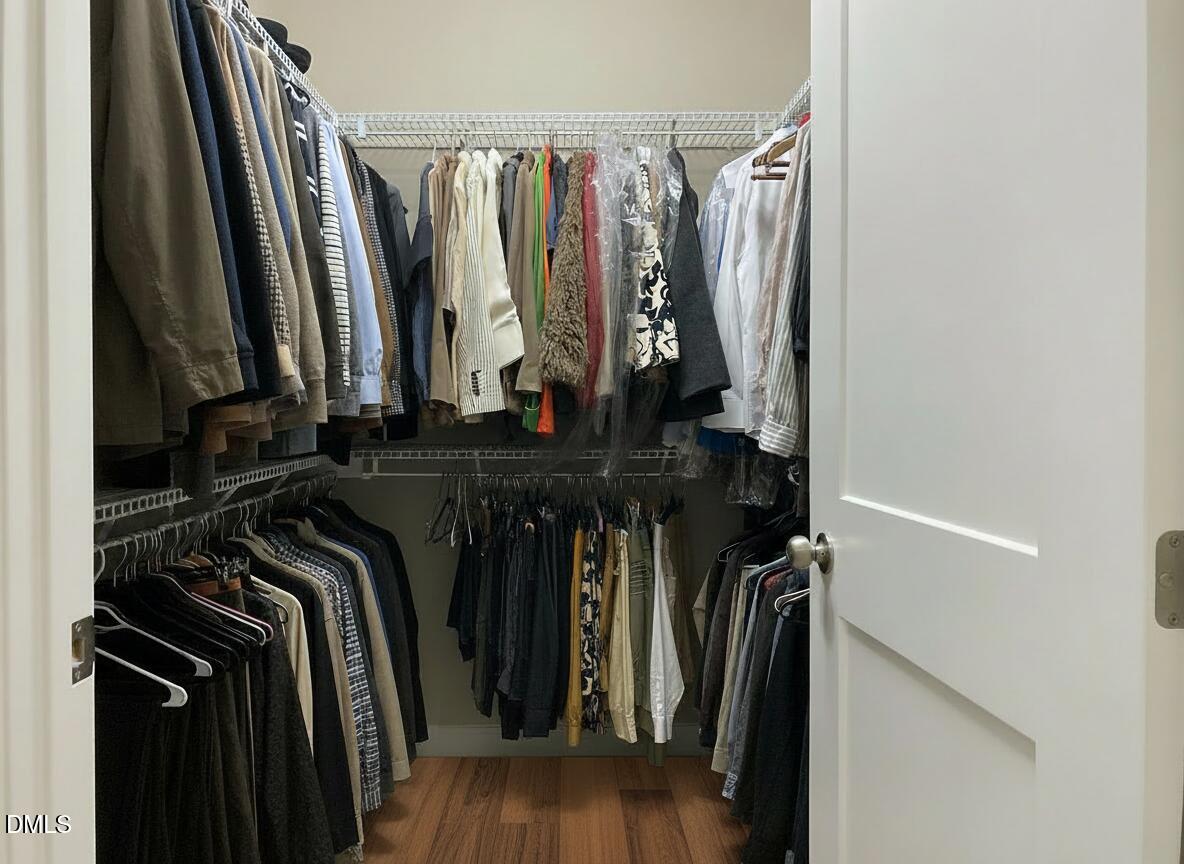 545 Libson Street Durham, NC 27703 - Photo 32 of 53 a view of walk in closet with clothes and shoes