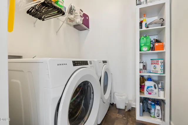 a view of two chairs in the balcony