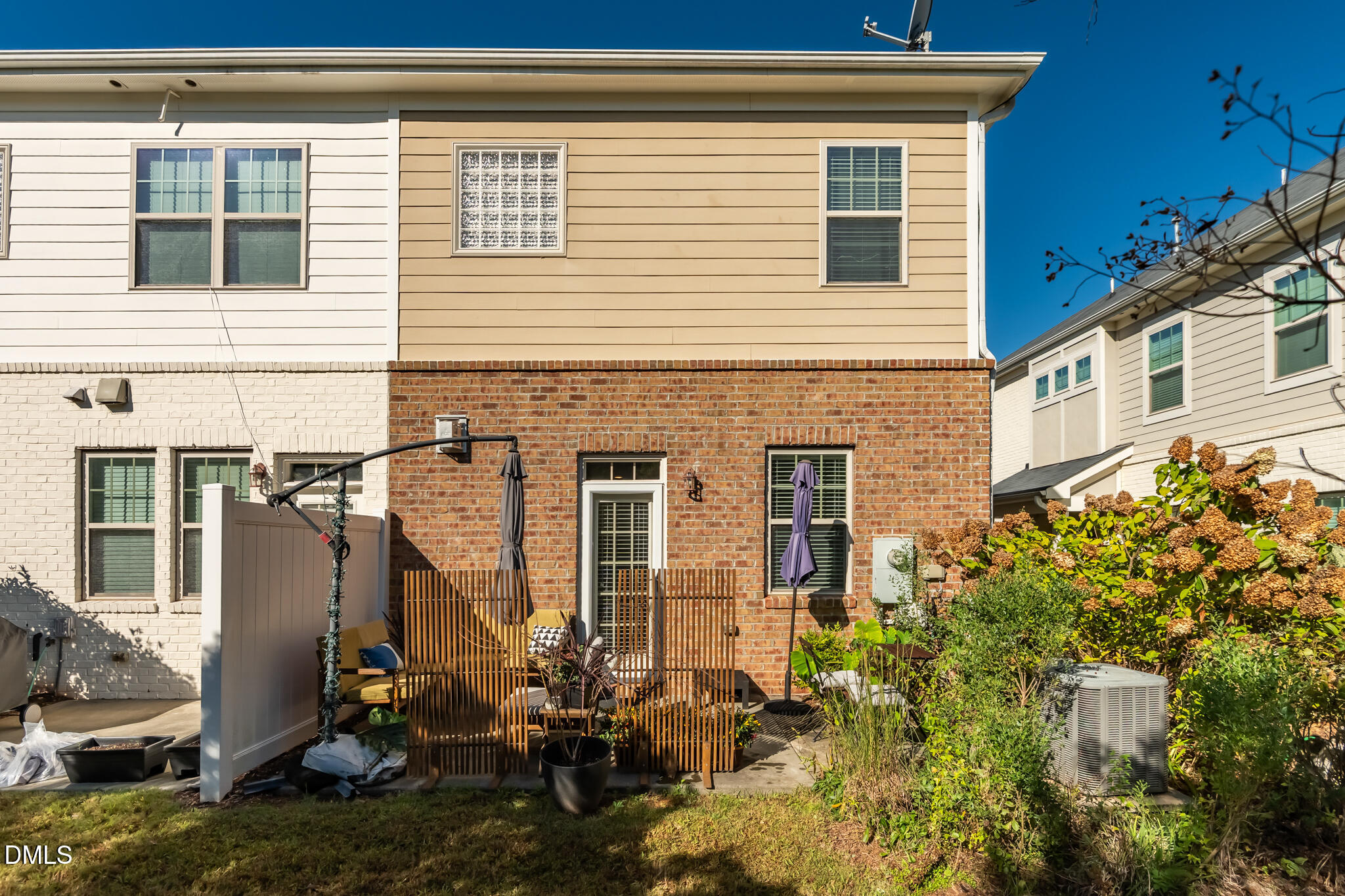 545 Libson Street Durham, NC 27703 - Photo 42 of 53 a view of a house with a small yard and potted plants