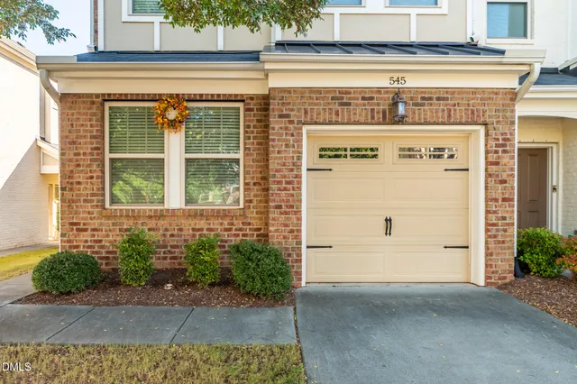 a potted plant sitting in front of a door