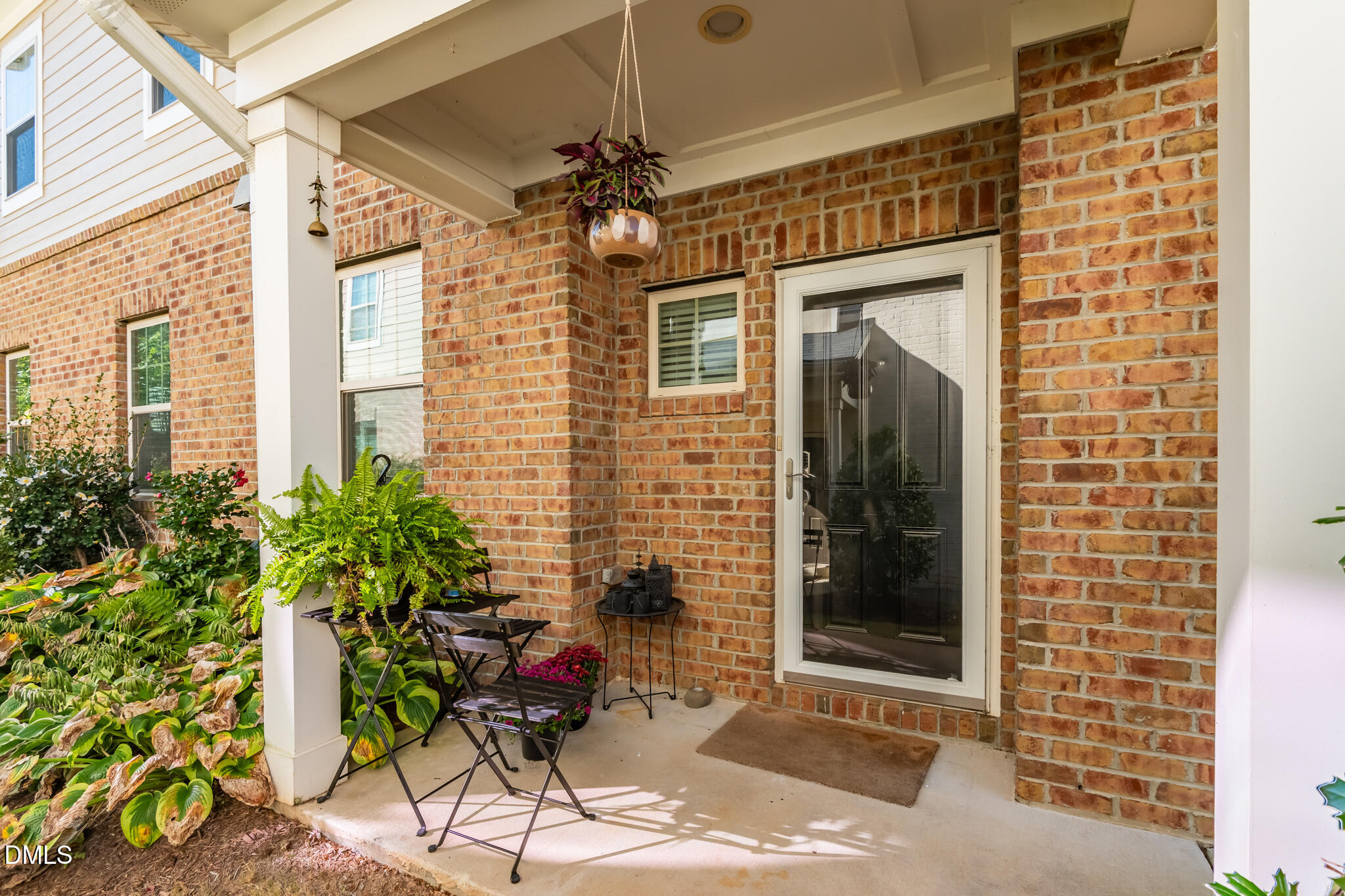 545 Libson Street Durham, NC 27703 - Photo 6 of 53 a potted plant sitting in front of a door