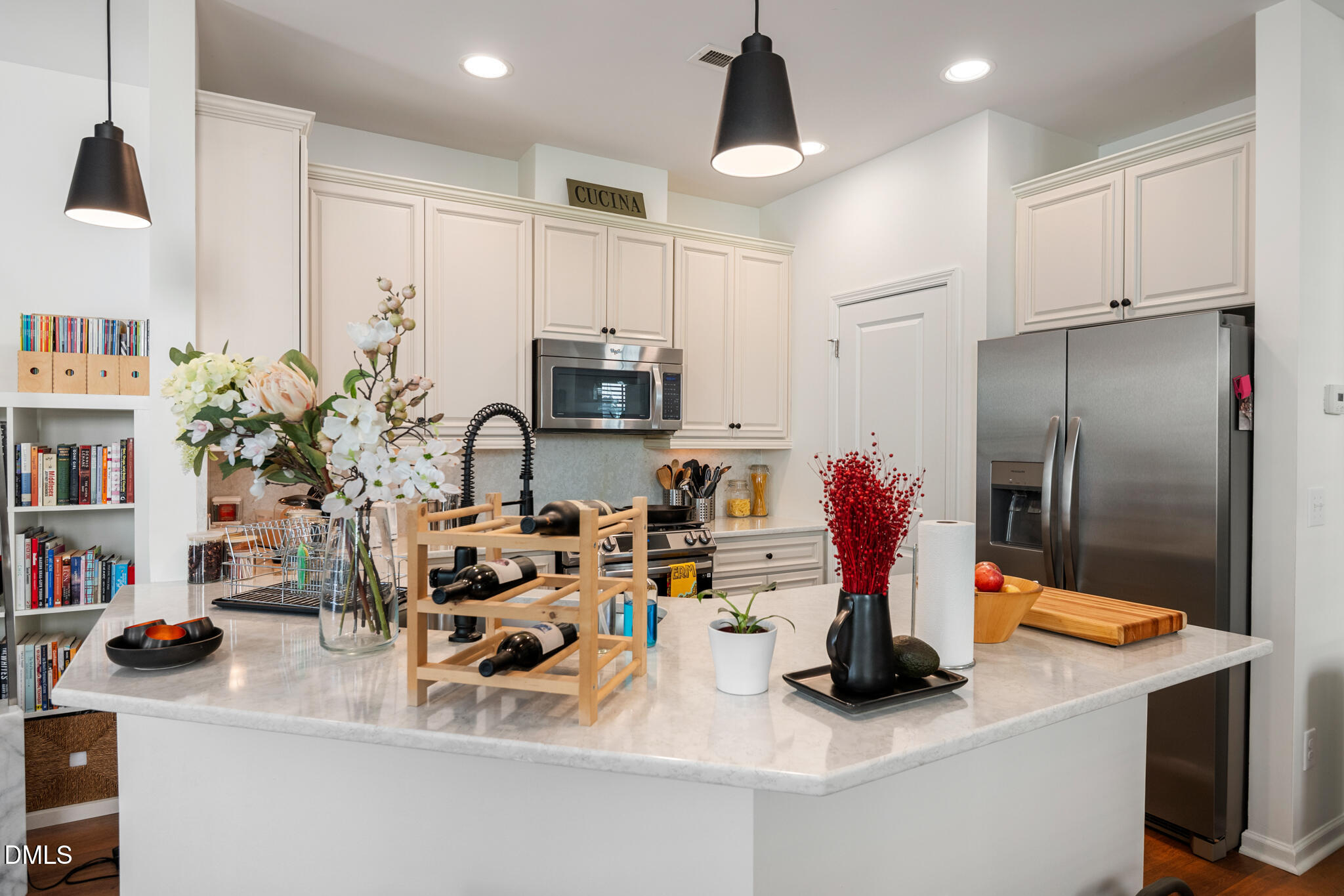 545 Libson Street Durham, NC 27703 - Photo 9 of 53 a kitchen with kitchen island a sink stove and refrigerator