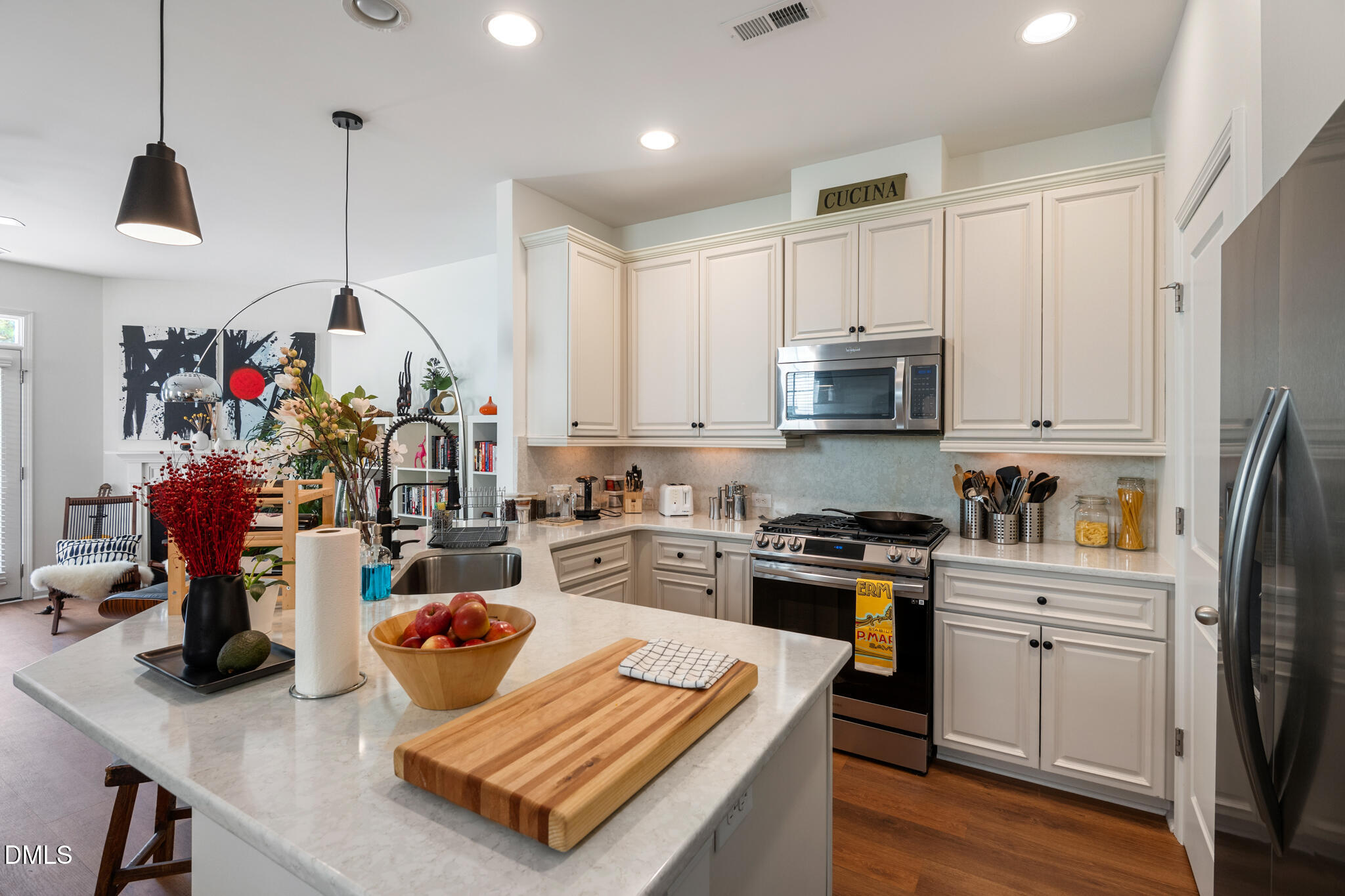 545 Libson Street Durham, NC 27703 - Photo 10 of 53 a kitchen with sink refrigerator and cabinets