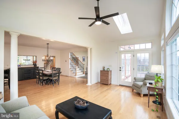 a kitchen with stainless steel appliances granite countertop a sink a stove and cabinets