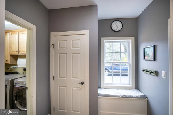 a bathroom with a granite countertop sink toilet a mirror and shower