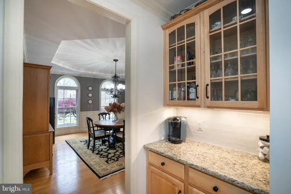a kitchen with stainless steel appliances granite countertop a stove a refrigerator and a refrigerator