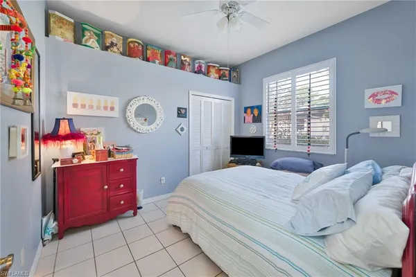 a spacious bathroom with a double vanity sink and a mirror