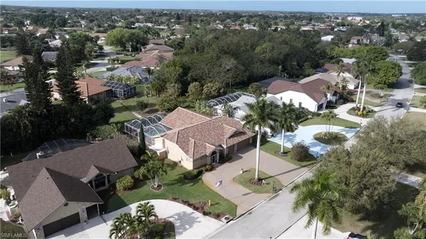 an aerial view of multiple houses with yard