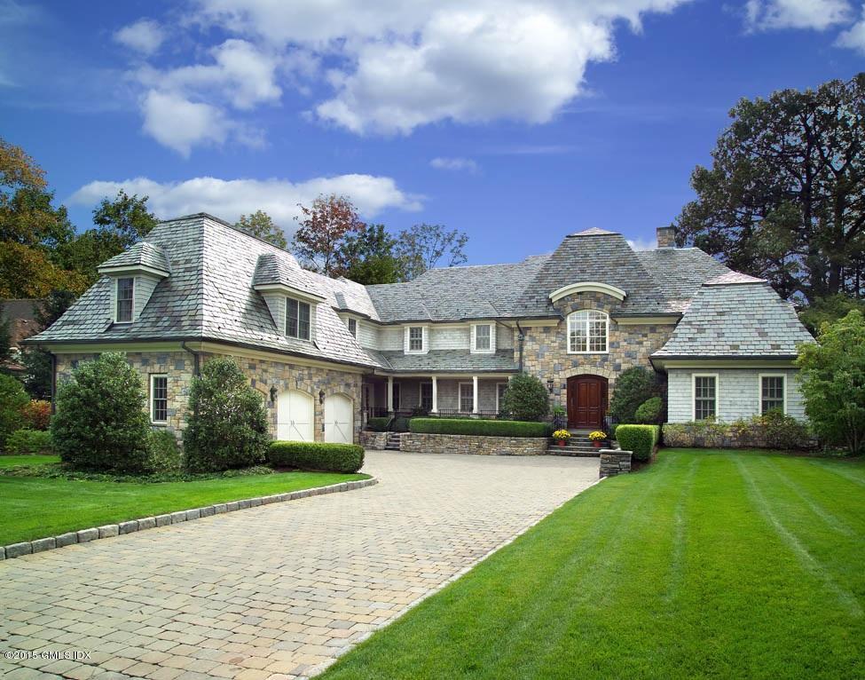 27 Chieftans Road Greenwich, CT 06831 - Photo 1 of 31 a front view of a house with a yard