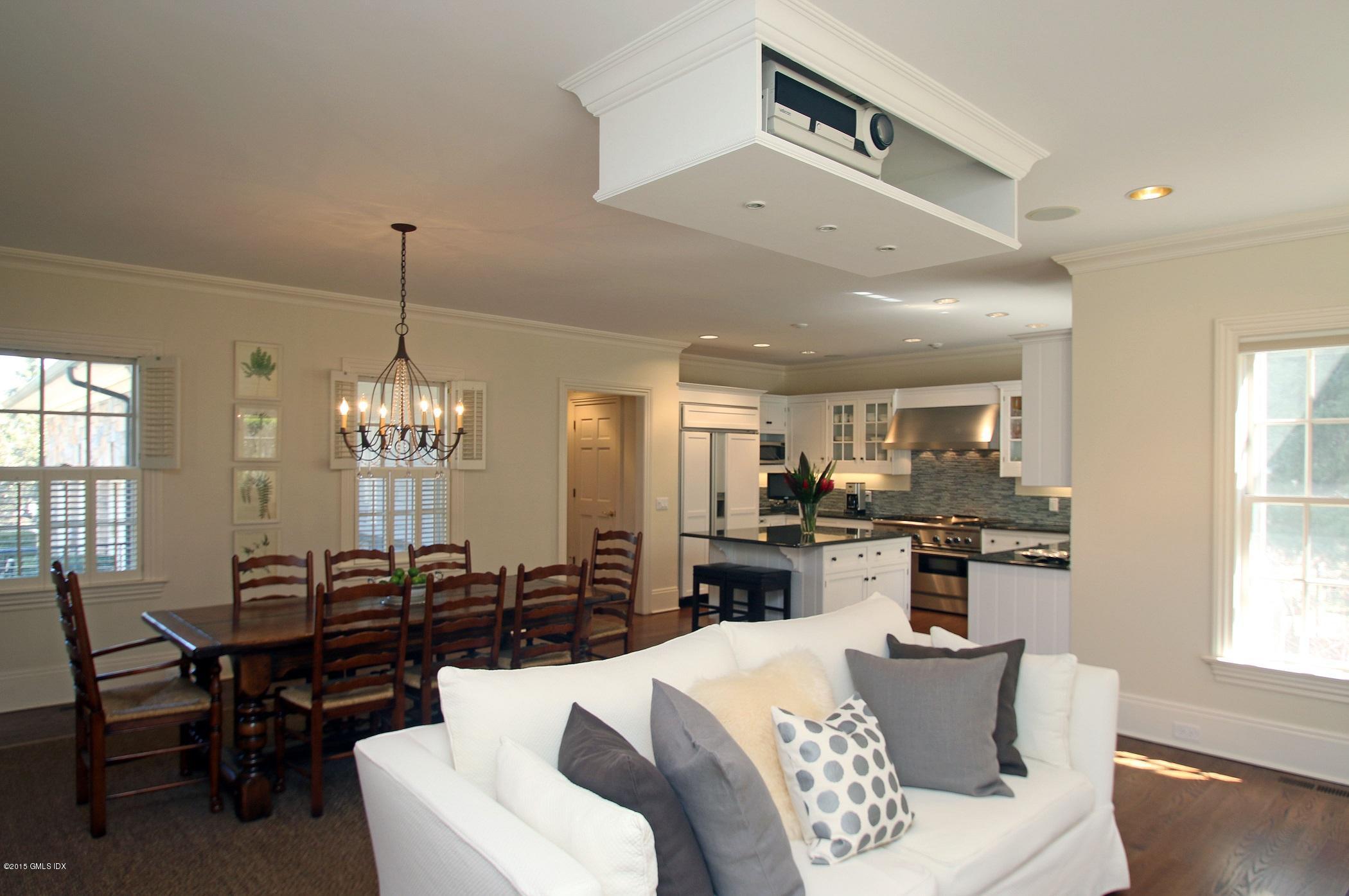 27 Chieftans Road Greenwich, CT 06831 - Photo 11 of 31 a large kitchen with a table and chairs