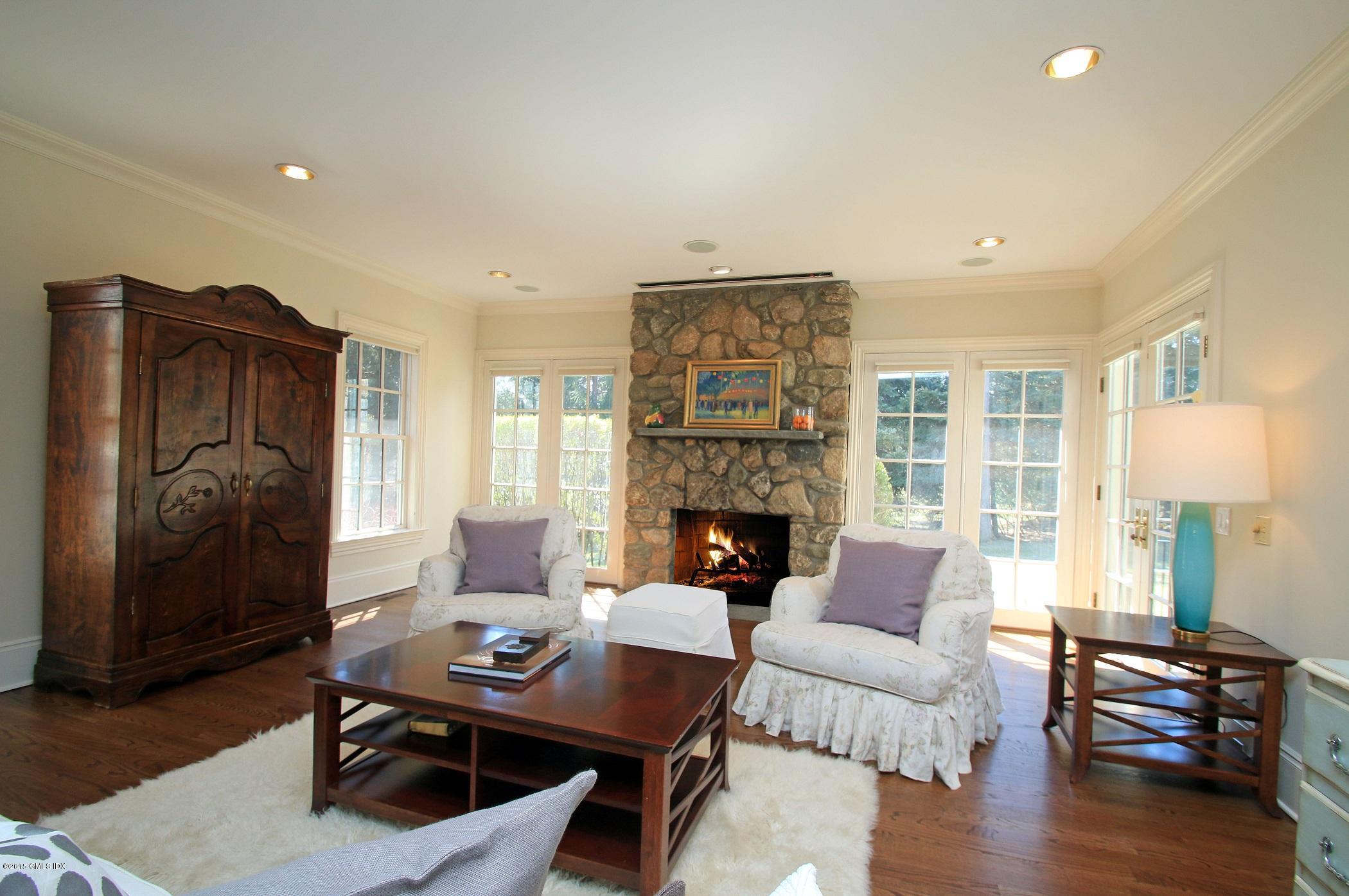 27 Chieftans Road Greenwich, CT 06831 - Photo 12 of 31 a living room with furniture and a fireplace