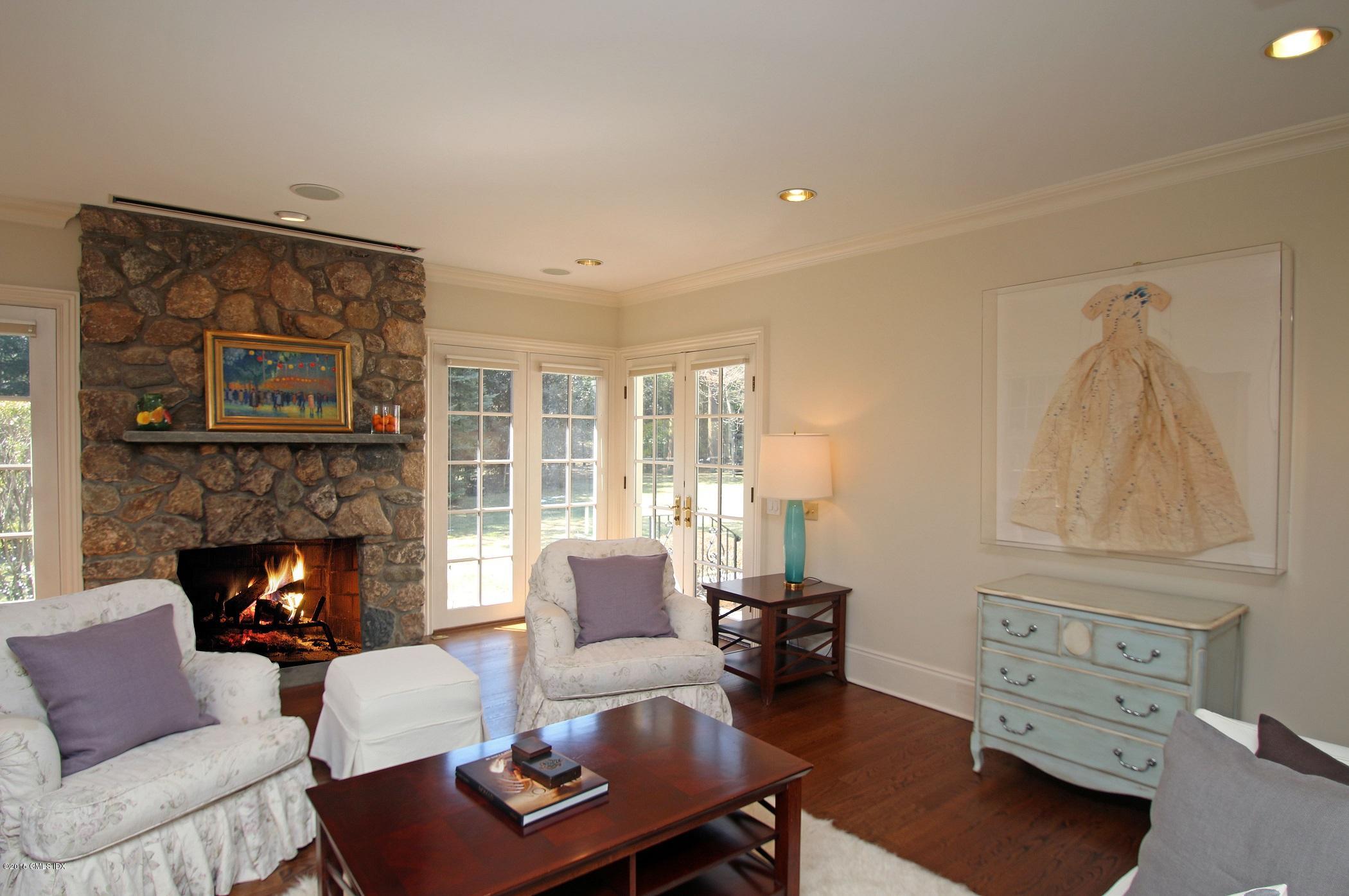 27 Chieftans Road Greenwich, CT 06831 - Photo 13 of 31 a living room with furniture and a fireplace