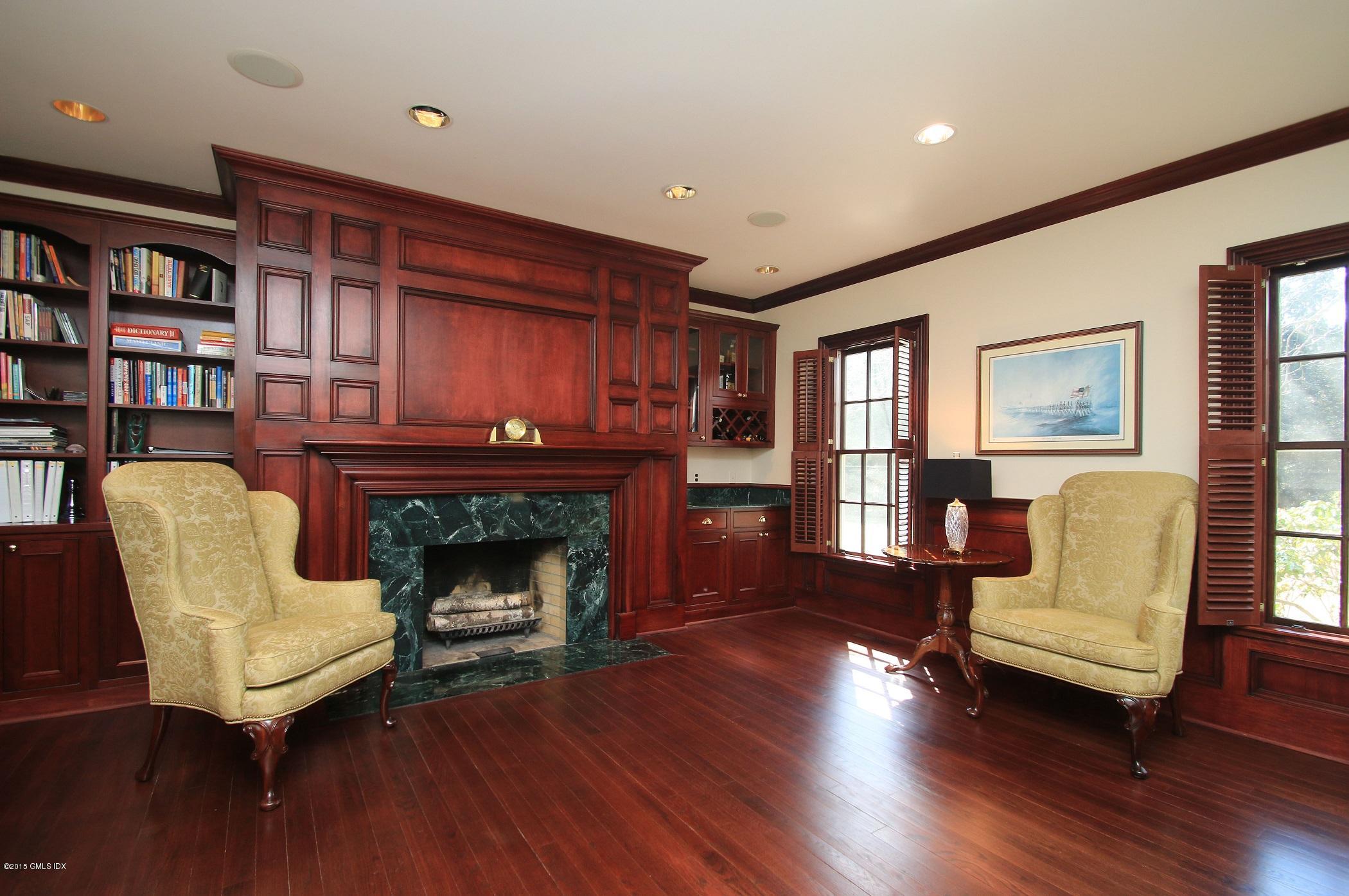 27 Chieftans Road Greenwich, CT 06831 - Photo 14 of 31 a living room with furniture and a fireplace