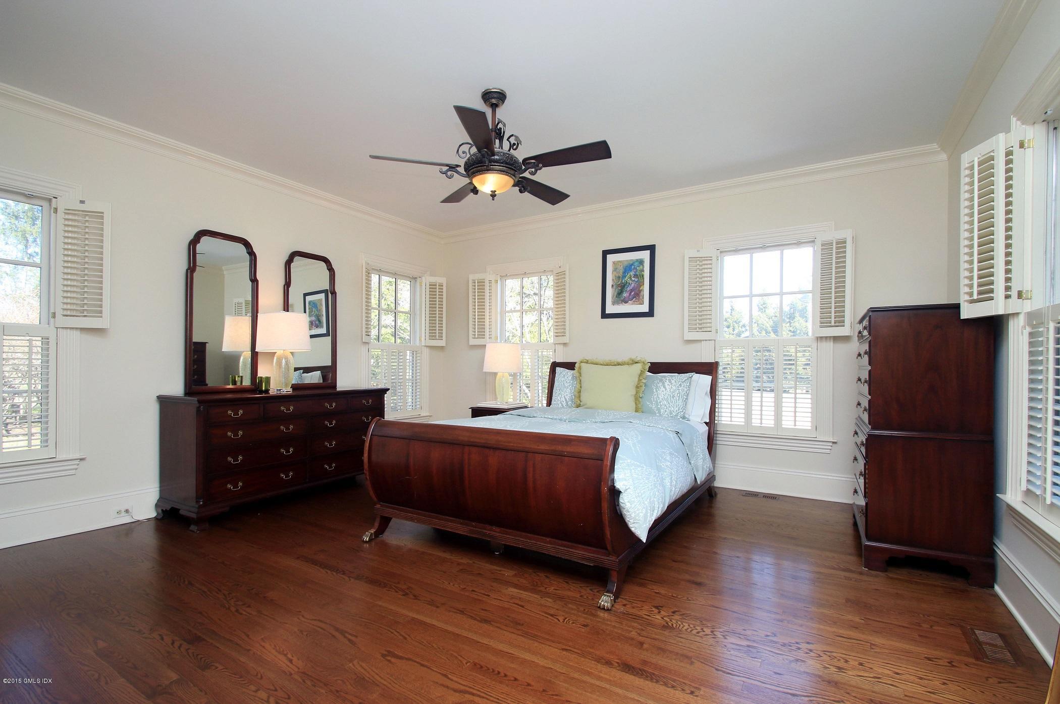 27 Chieftans Road Greenwich, CT 06831 - Photo 15 of 31 a bed room with a bed and a window