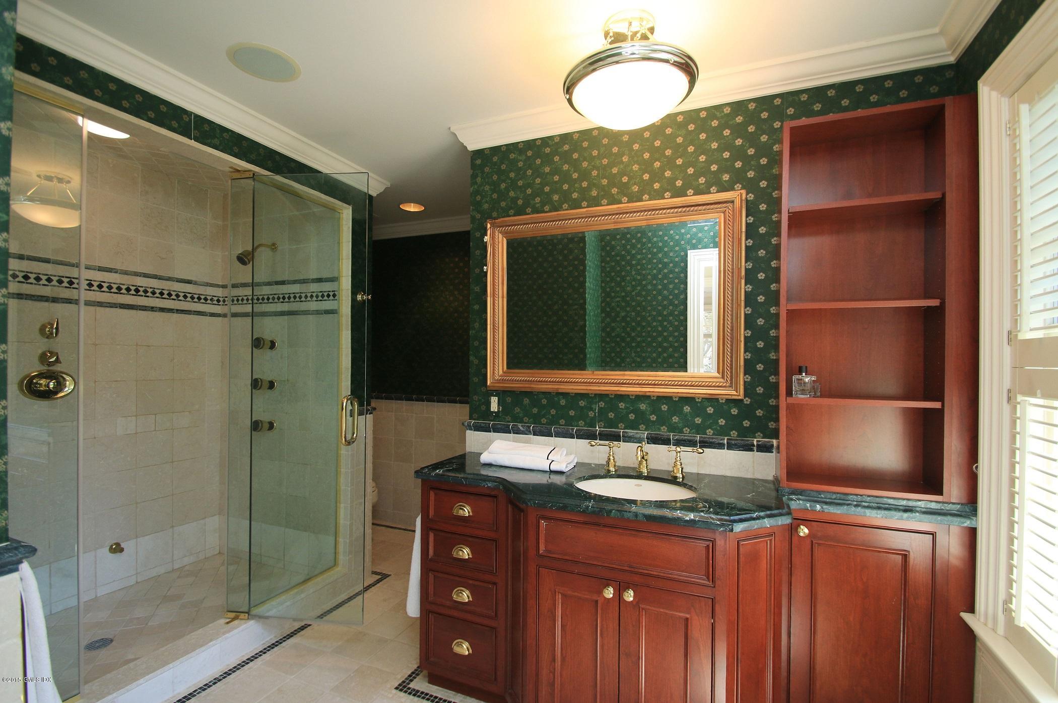 27 Chieftans Road Greenwich, CT 06831 - Photo 21 of 31 a bathroom with a sink and a mirror