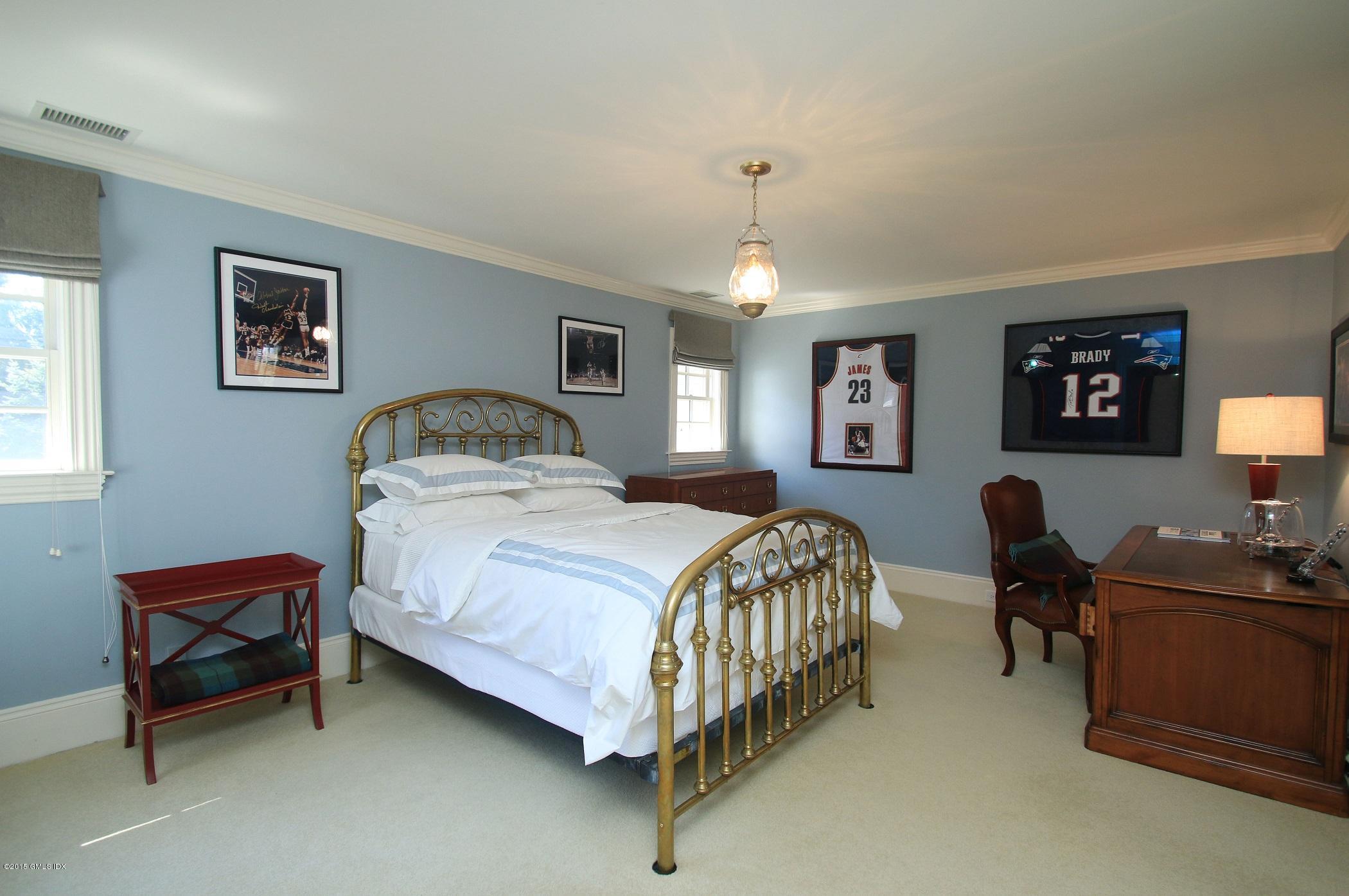 27 Chieftans Road Greenwich, CT 06831 - Photo 24 of 31 a bedroom with a bed and dresser
