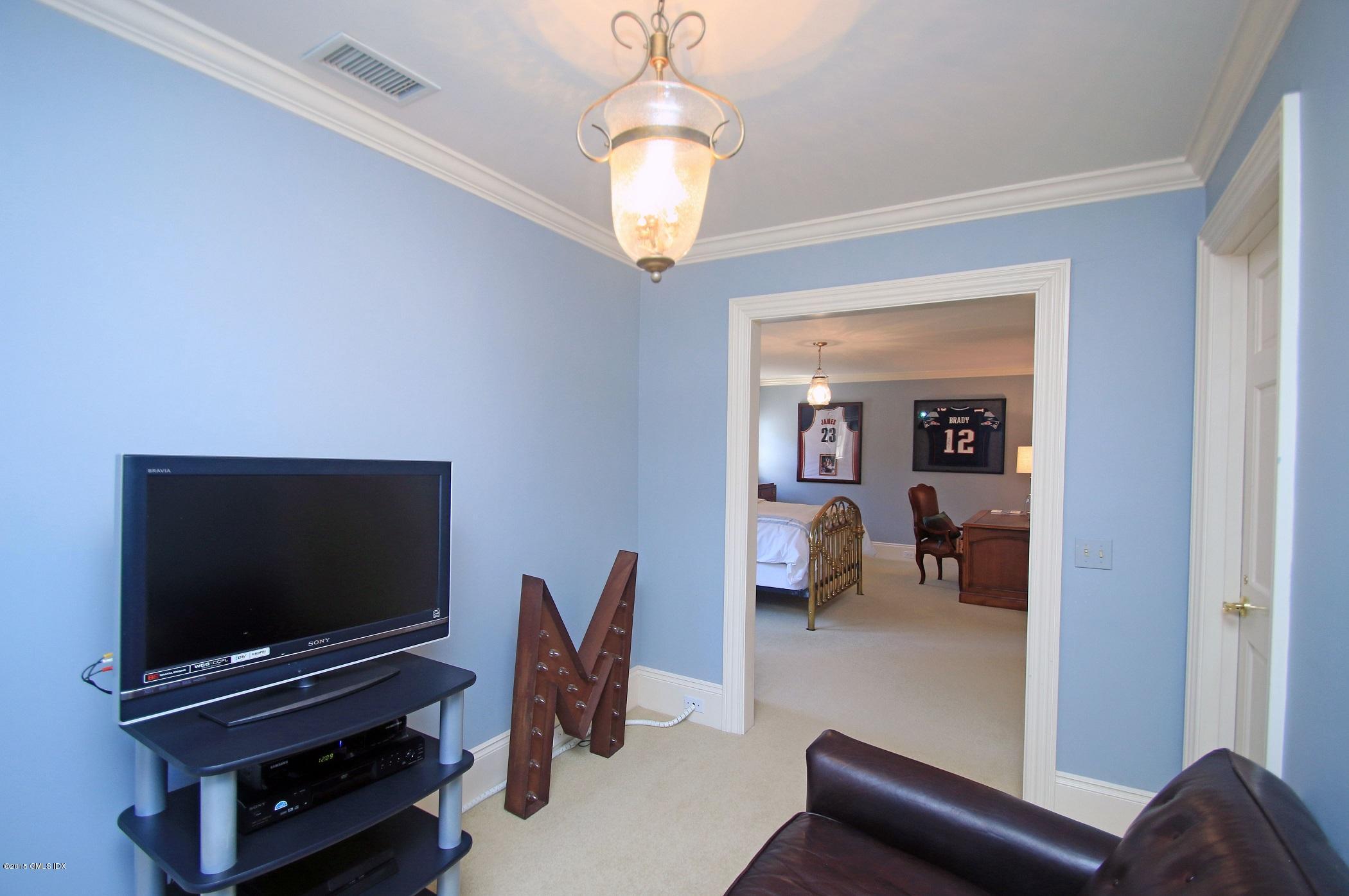 27 Chieftans Road Greenwich, CT 06831 - Photo 25 of 31 a living room with furniture and a flat screen tv