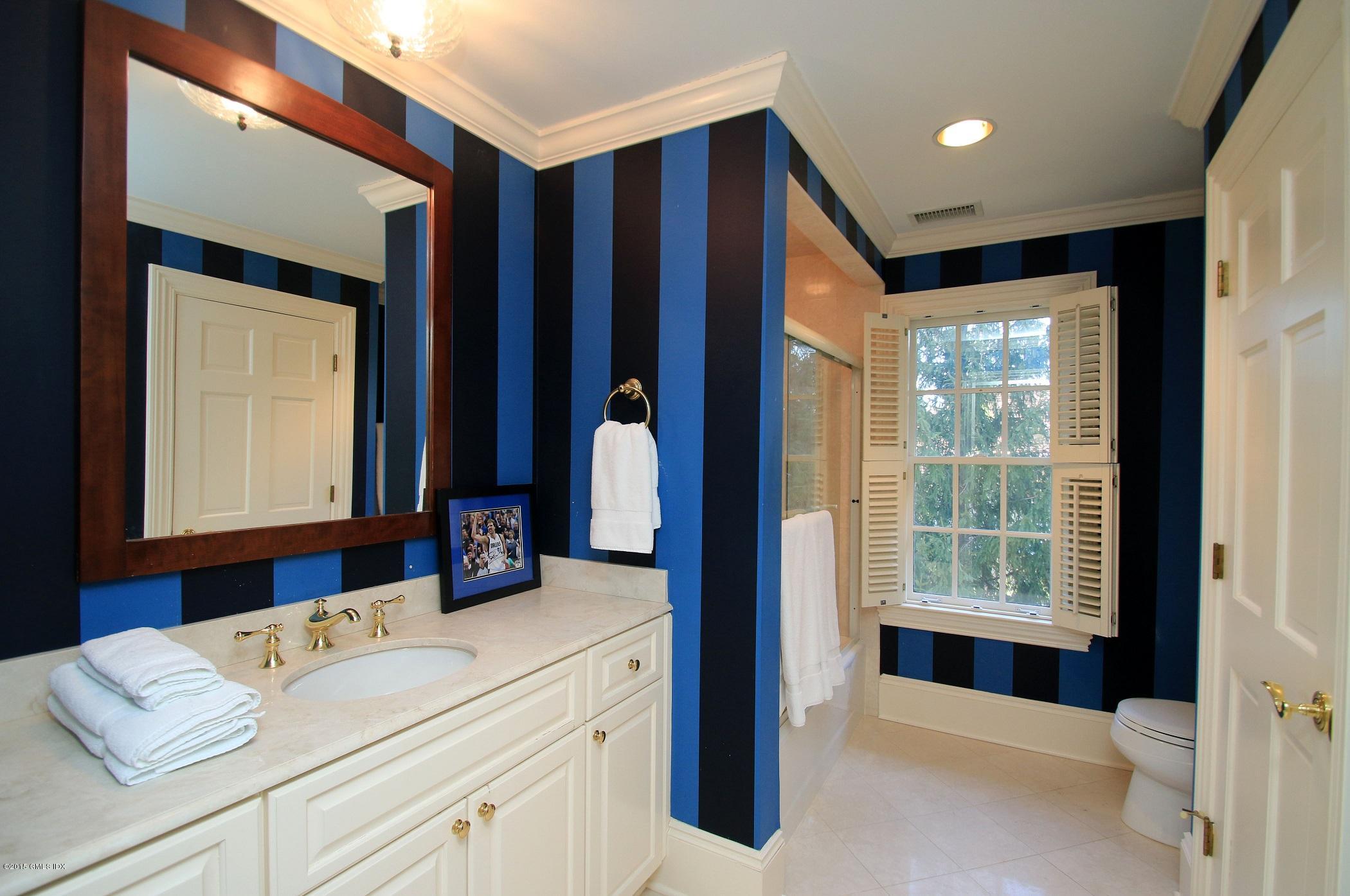 27 Chieftans Road Greenwich, CT 06831 - Photo 26 of 31 a view of en suite bathroom with a tub and a large window