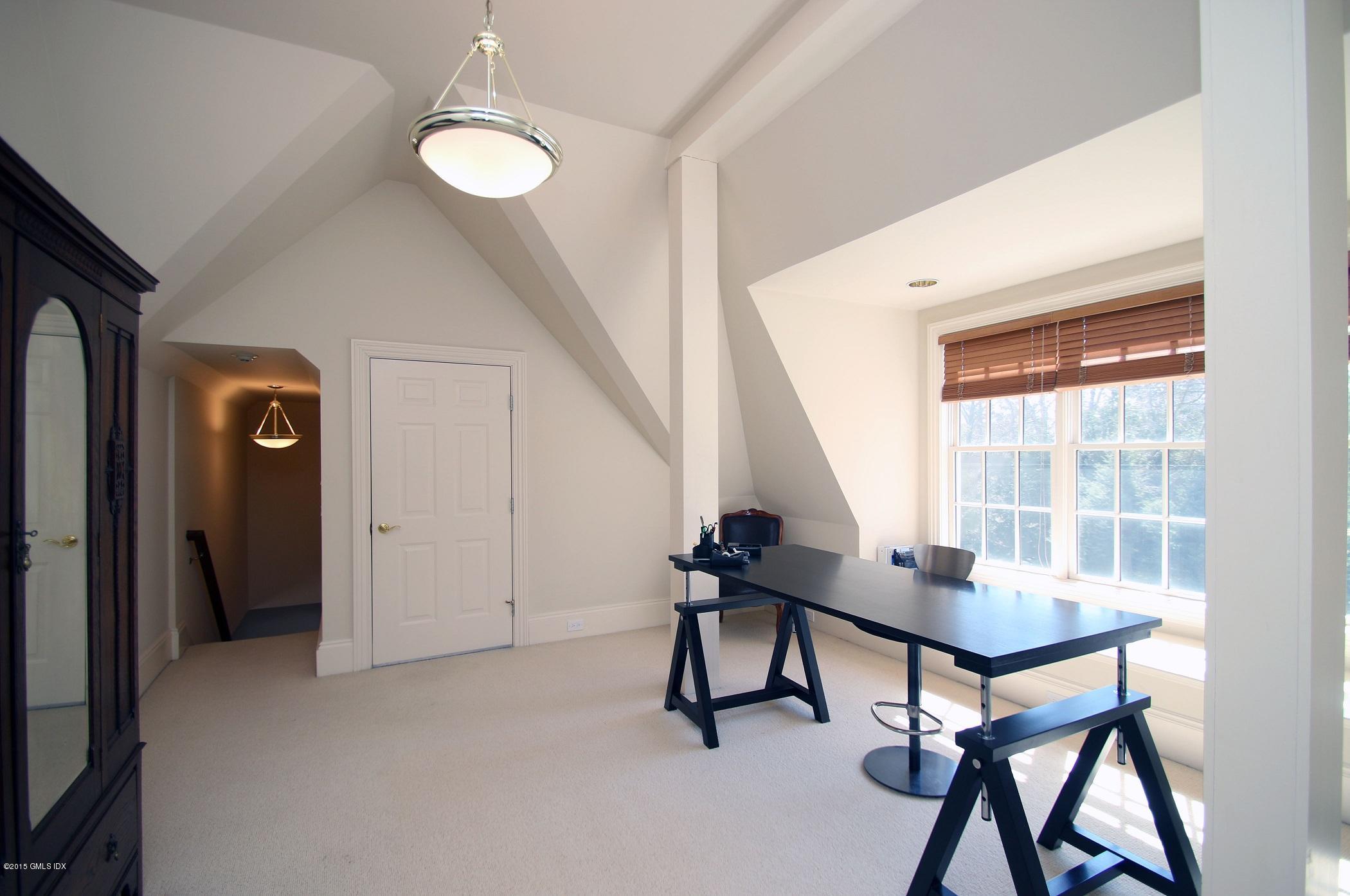 27 Chieftans Road Greenwich, CT 06831 - Photo 28 of 31 a view of a livingroom with furniture and window