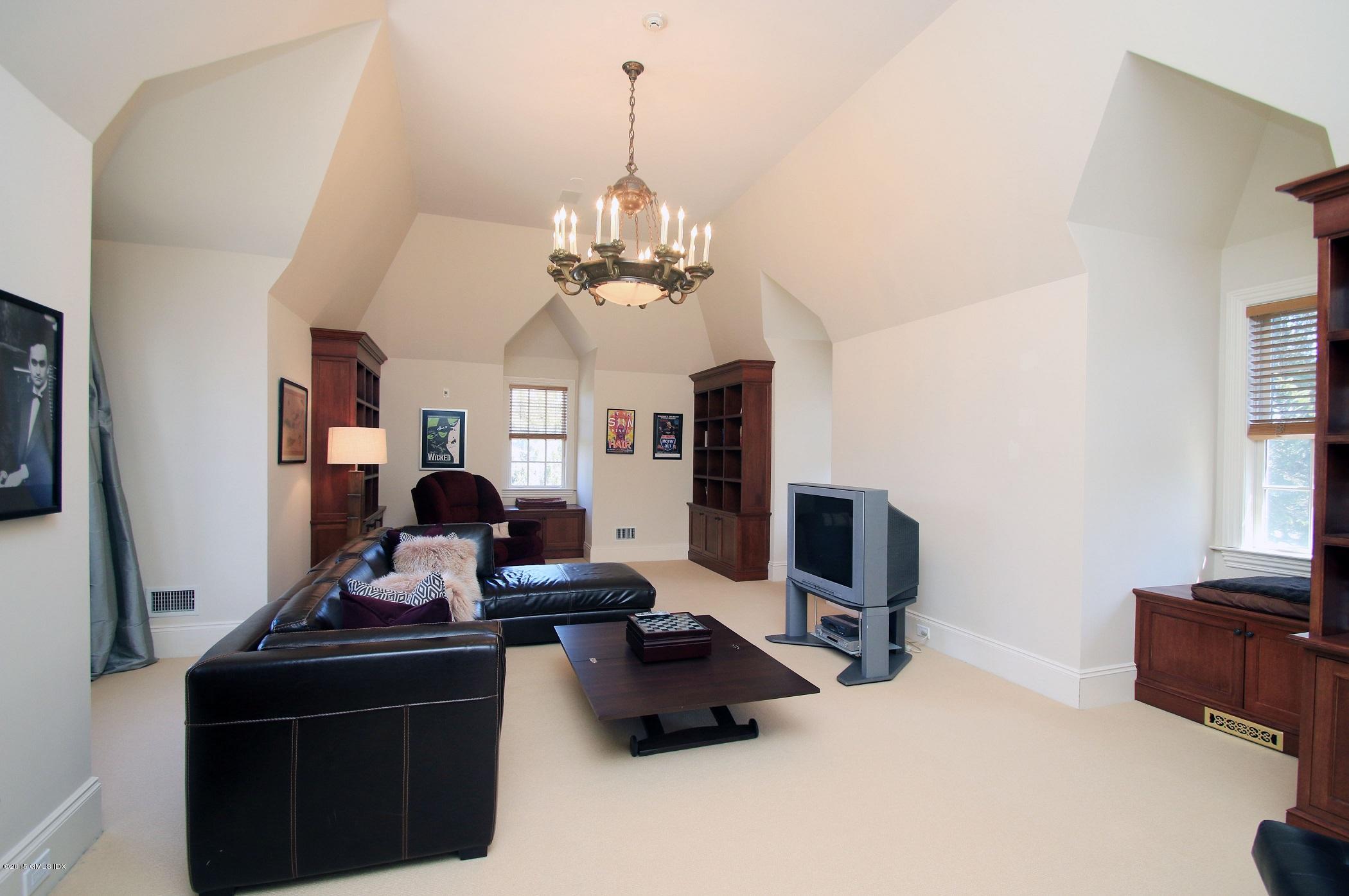 27 Chieftans Road Greenwich, CT 06831 - Photo 29 of 31 a living room with furniture and a flat screen tv