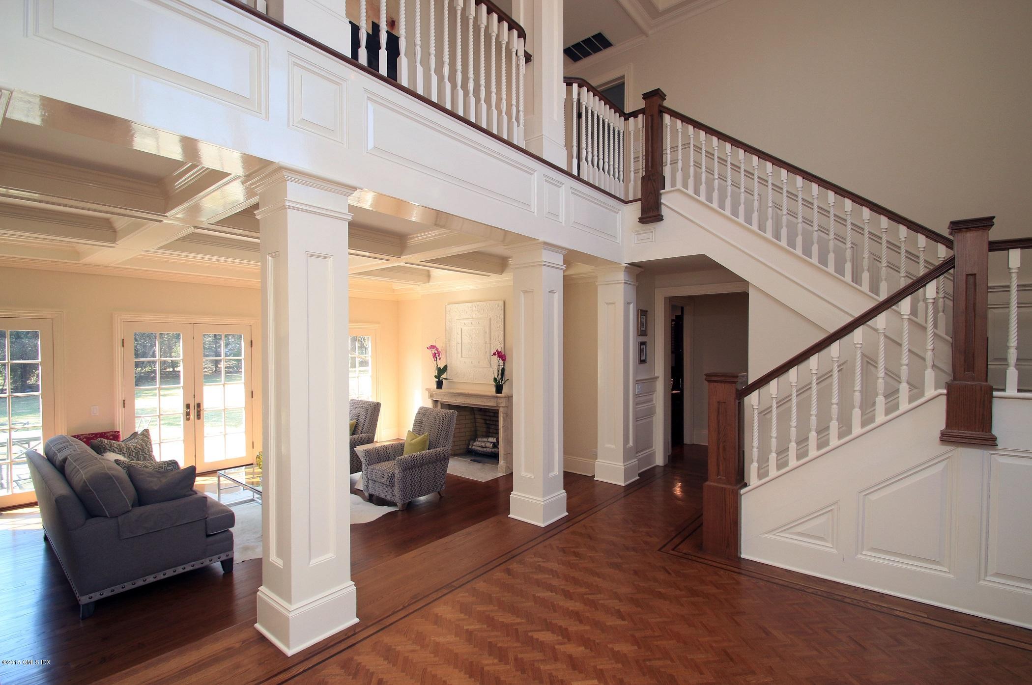 27 Chieftans Road Greenwich, CT 06831 - Photo 3 of 31 a view of a livingroom with furniture and stairs