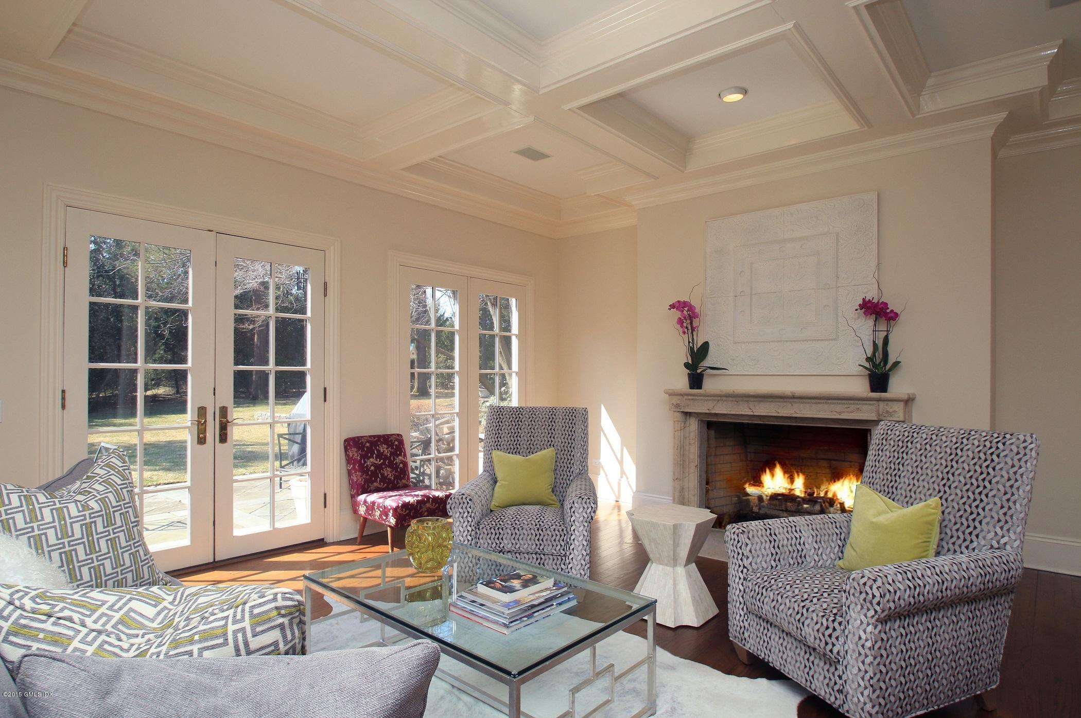 27 Chieftans Road Greenwich, CT 06831 - Photo 5 of 31 a living room with furniture and a fireplace