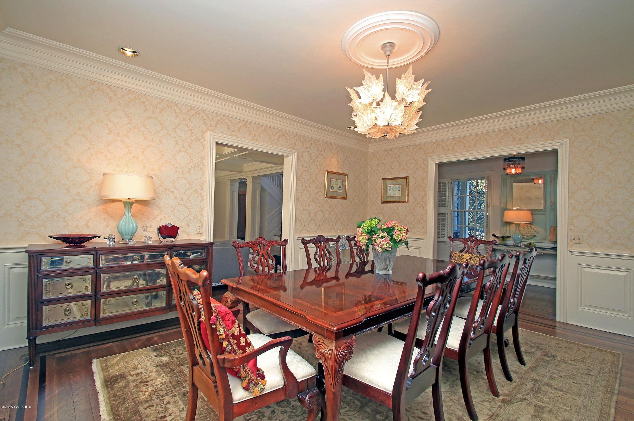 27 Chieftans Road Greenwich, CT 06831 - Photo 7 of 31 a view of a dining room with furniture and chandelier