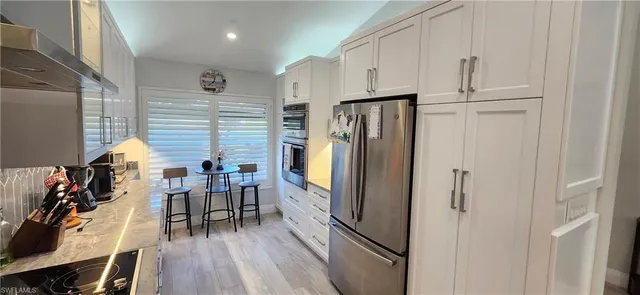 a view of dining room with furniture and wooden floor