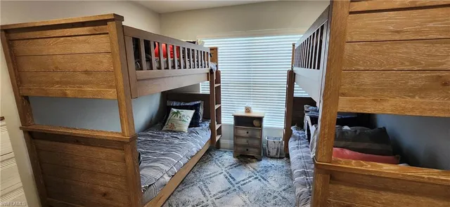a view of living room with furniture and a fireplace