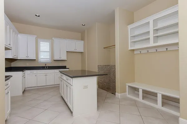 a kitchen with a cabinets and counter space