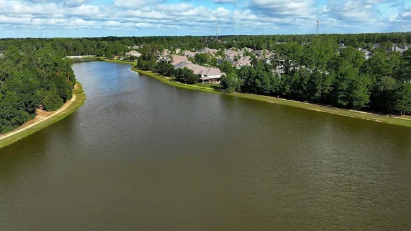 a view of a lake with a city