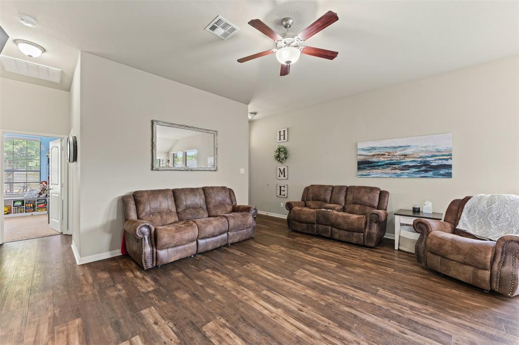 10313 Condor Loop Waco, TX 76708 - Photo 13 of 33 Wood-finish flooring throughout, ceiling fan with integrated lighting, recessed lighting, and neutral wall tones