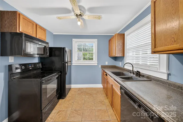 a kitchen with a sink stove and refrigerator