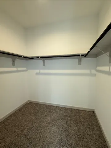 a bathroom with a tub a sink and a shower