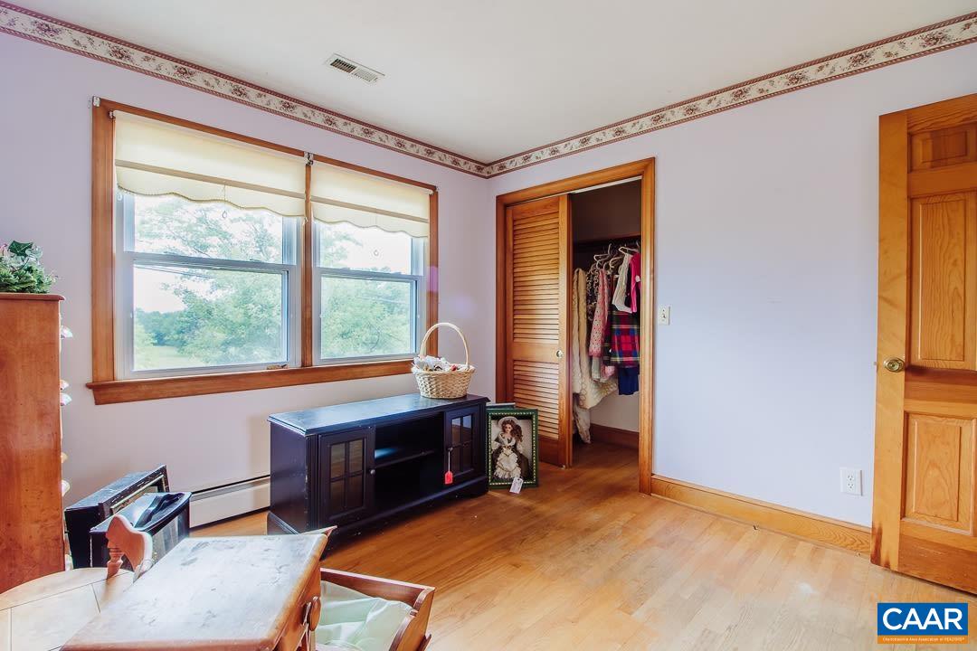 5742 Willow Spring Road Crozet, VA 22932 - Photo 18 of 34 a room with furniture and a window