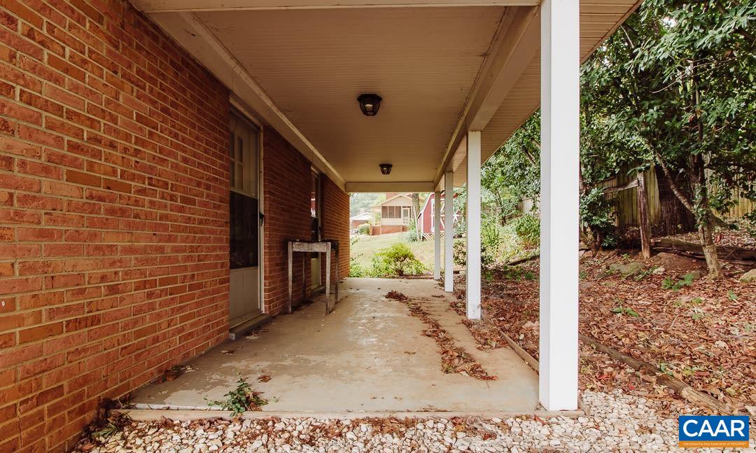 5742 Willow Spring Road Crozet, VA 22932 - Photo 27 of 34 a view of a porch with furniture and a yard