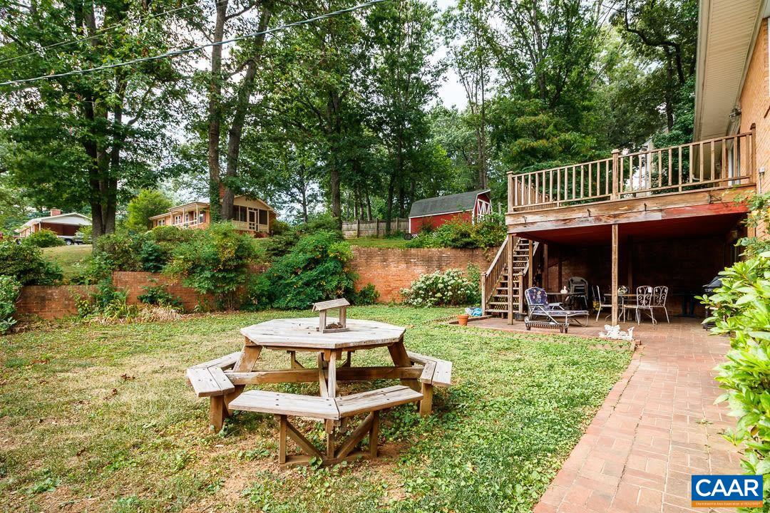 5742 Willow Spring Road Crozet, VA 22932 - Photo 28 of 34 a view of a chair and table in backyard of the house