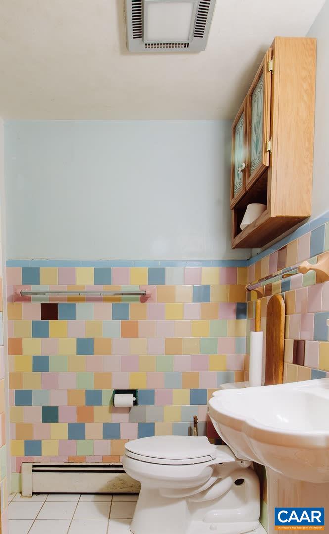 5742 Willow Spring Road Crozet, VA 22932 - Photo 31 of 34 a bathroom with a sink and a mirror