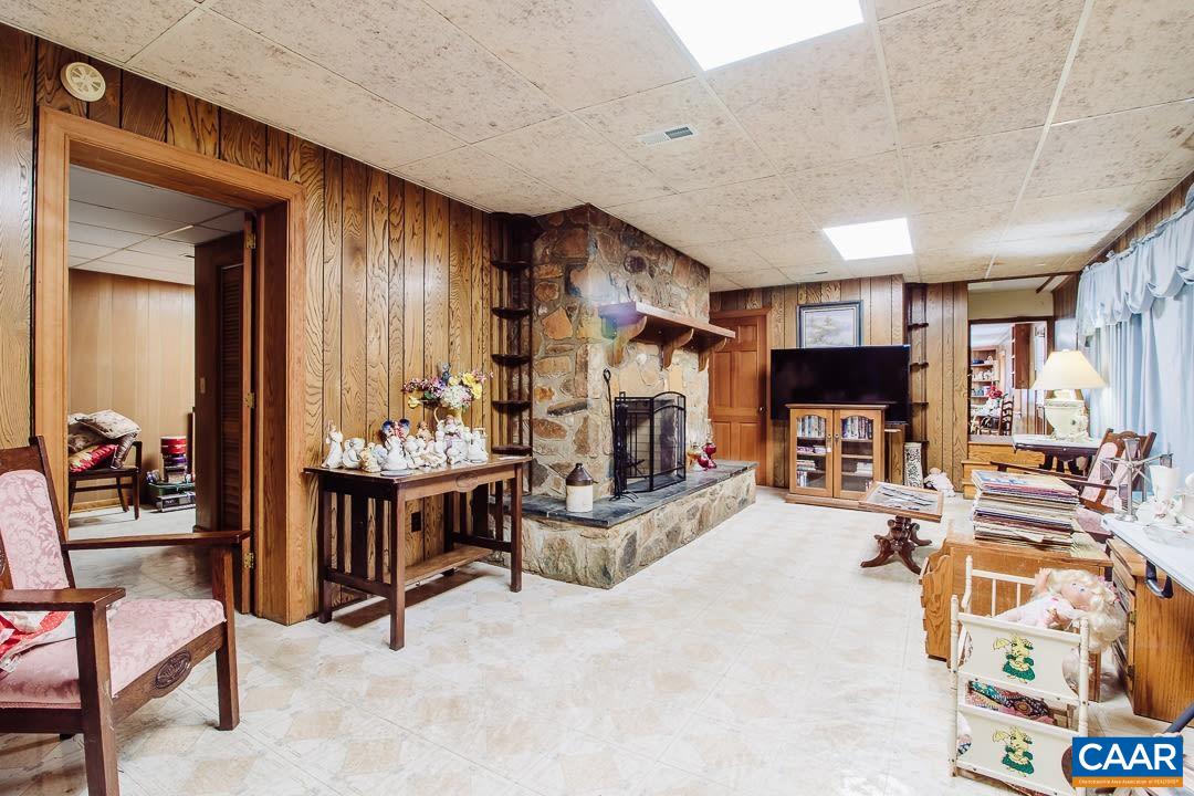 5742 Willow Spring Road Crozet, VA 22932 - Photo 32 of 34 a living room with furniture and a flat screen tv