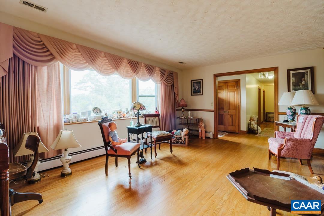5742 Willow Spring Road Crozet, VA 22932 - Photo 5 of 34 a living room with furniture and a large window