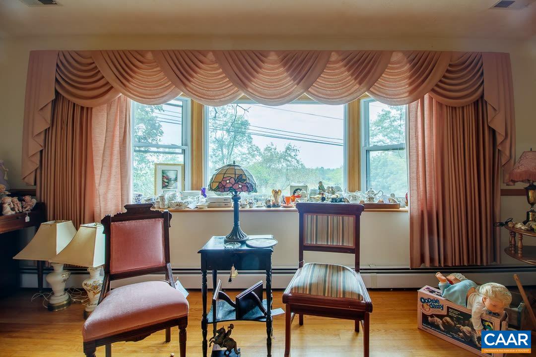 5742 Willow Spring Road Crozet, VA 22932 - Photo 6 of 34 a living room with furniture and a large window