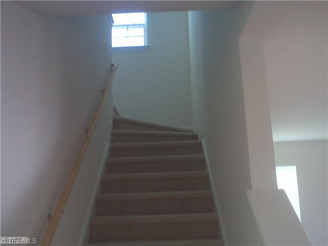 1328 Sharp Ridge Road Greensboro, NC 27406 - Photo 9 of 11 Other. Turning stairwell going upstairs to bonus room and three other bedrooms with walkin closets.